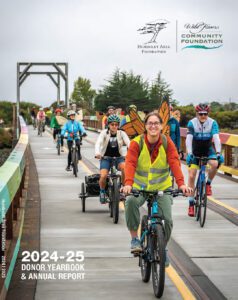 Cover of the '24-'25 donor yearbook featuring a group of people riding bicycles on the Humboldt Bay Trail.