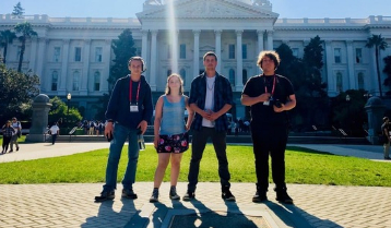 kids standing in front of a government building