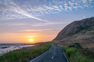 sunset and road on the coast